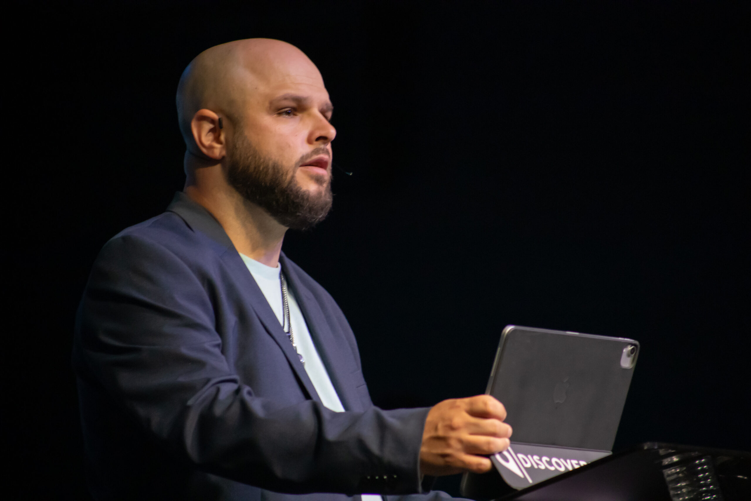 Andy McMahon, founder of Phoenix Publishing, speaking on stage
