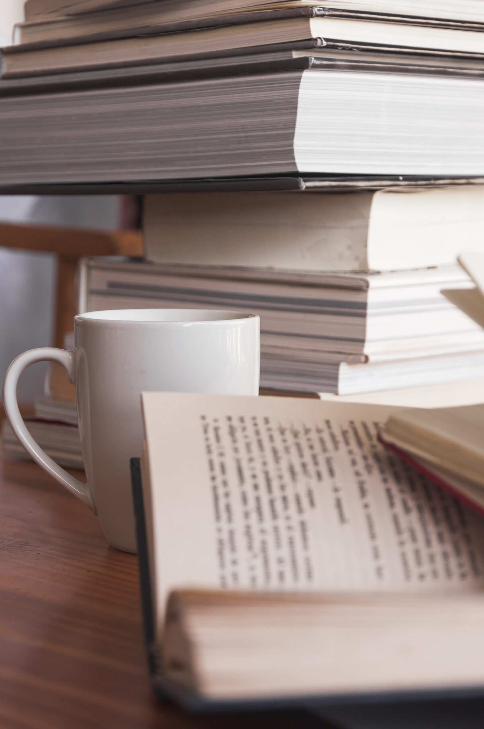 mug-standing-near-books A mug beside an open notebook and books